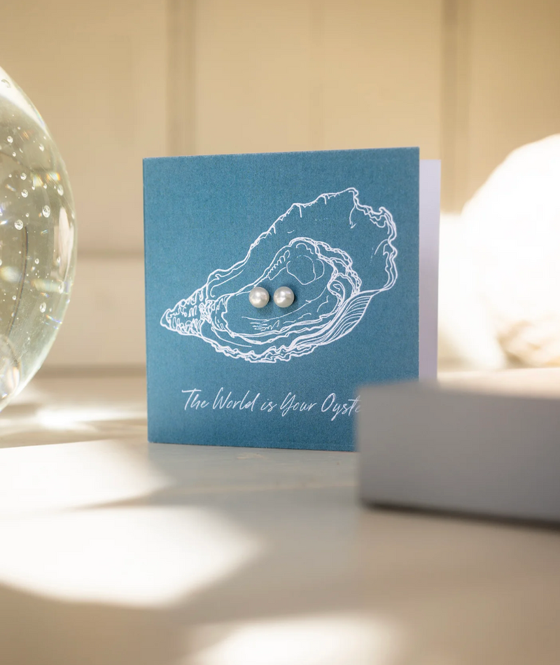 CLAUDIA BRADBY THE WORLD IS YOUR OYSTER GIFT CARD WITH PEARL STUDS